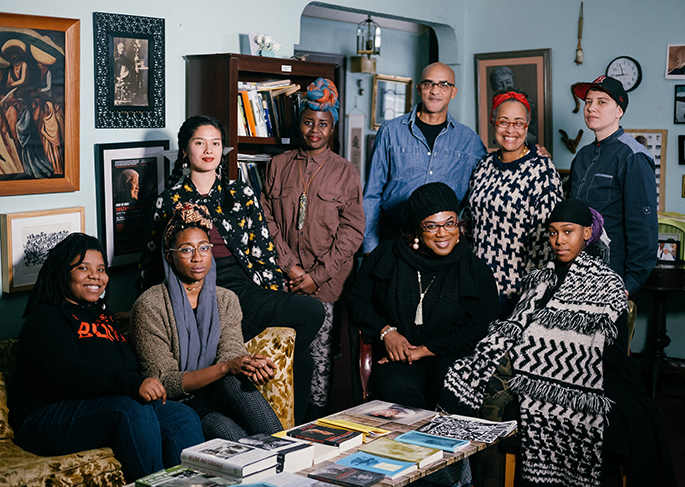 A group of Detroiters associated with the Detroit Narrative Agency in a living room setting