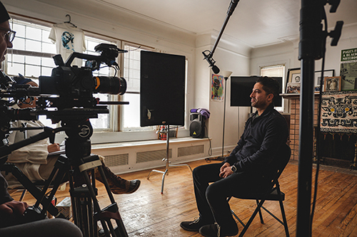 Production still from Dangerous Times: Rebellious Responses of a person interviewed on camera