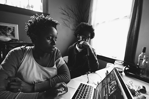 A still from Sidelots of two people on a laptop